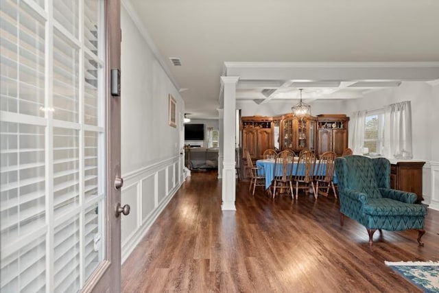 interior space with coffered ceiling, ornamental molding, dark hardwood / wood-style flooring, and beam ceiling