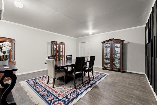 dining area featuring crown molding and dark hardwood / wood-style flooring