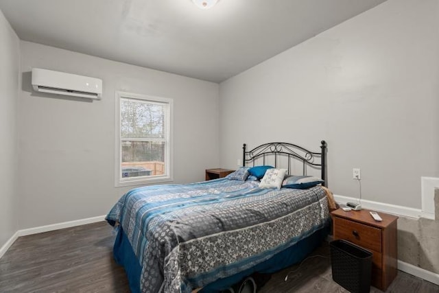 bedroom featuring dark wood-type flooring and a wall mounted AC