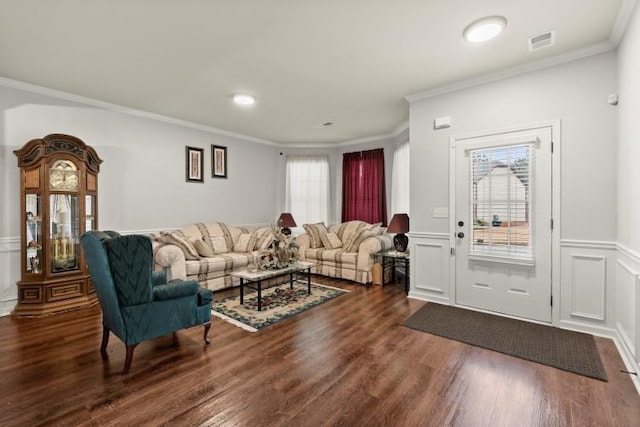 living room featuring ornamental molding, plenty of natural light, and dark hardwood / wood-style floors