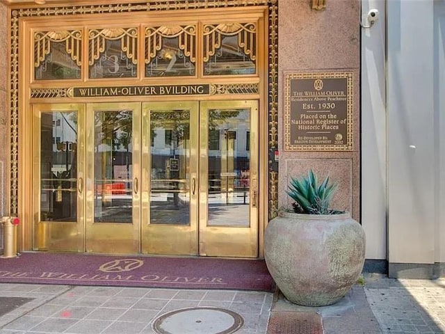 view of exterior entry featuring french doors