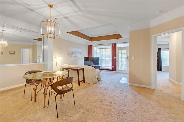 dining space with a notable chandelier, light colored carpet, and ornamental molding