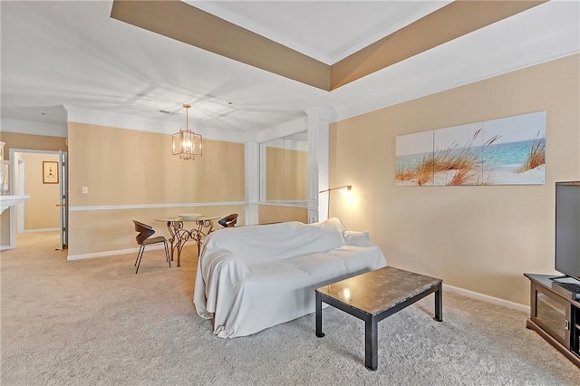 carpeted bedroom with a notable chandelier