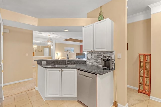 kitchen featuring stainless steel dishwasher, white cabinetry, sink, and light tile patterned floors