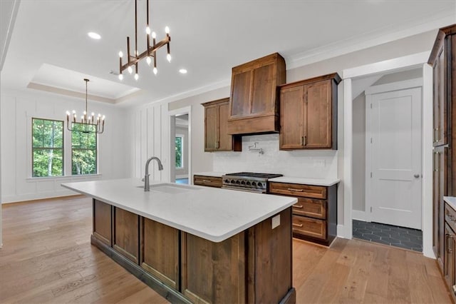 33 Cedar Gate Ln, Kingston, GA 30145 - kitchen with a chandelier, a sink, high end range, light wood-style flooring, and crown molding