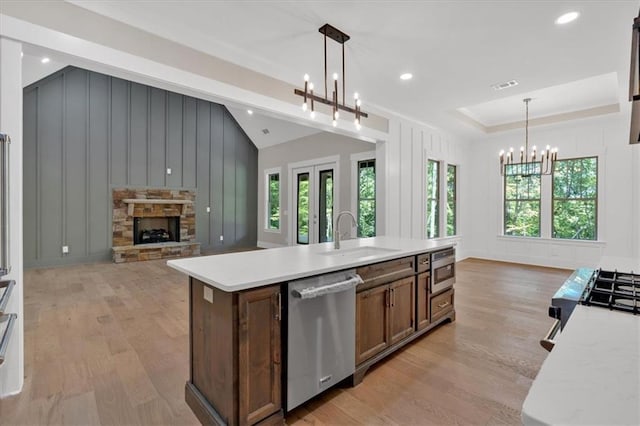 33 Cedar Gate Ln, Kingston, GA 30145 - kitchen featuring a sink, dishwasher, a chandelier, a decorative wall, and light wood-style flooring