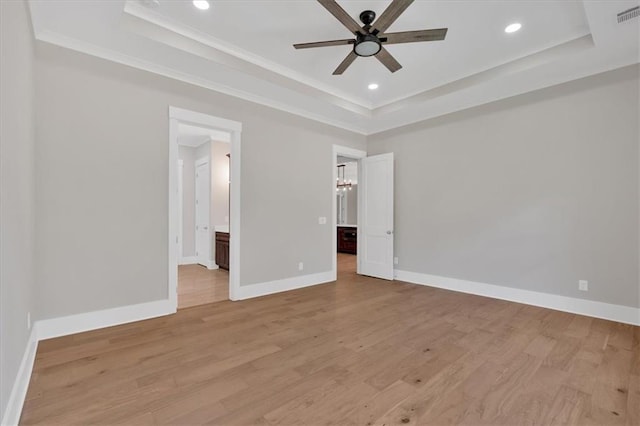 33 Cedar Gate Ln, Kingston, GA 30145 - unfurnished bedroom with a raised ceiling, baseboards, light wood-style floors, ornamental molding, and connected bathroom