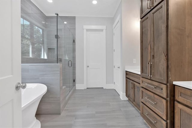 33 Cedar Gate Ln, Kingston, GA 30145 - bathroom with a stall shower, vanity, a freestanding bath, baseboards, and recessed lighting