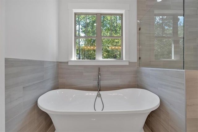 33 Cedar Gate Ln, Kingston, GA 30145 - full bathroom with tile walls, a freestanding tub, and a wainscoted wall