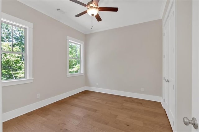 33 Cedar Gate Ln, Kingston, GA 30145 - spare room with healthy amount of natural light, wood finished floors, and a ceiling fan
