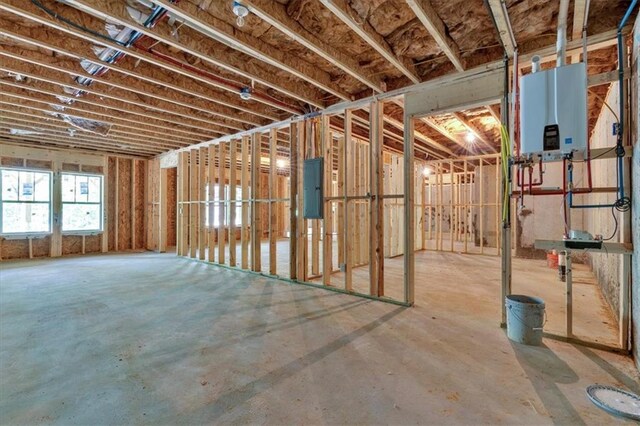 33 Cedar Gate Ln, Kingston, GA 30145 - miscellaneous room with tankless water heater, electric panel, and concrete flooring