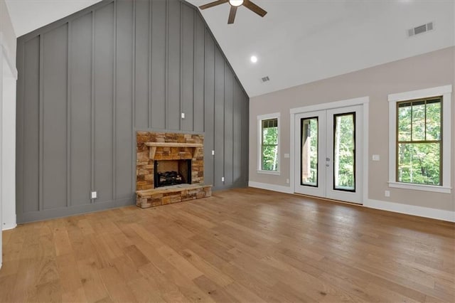 33 Cedar Gate Ln, Kingston, GA 30145 - unfurnished living room with ceiling fan, light wood finished floors, baseboards, high vaulted ceiling, and a fireplace