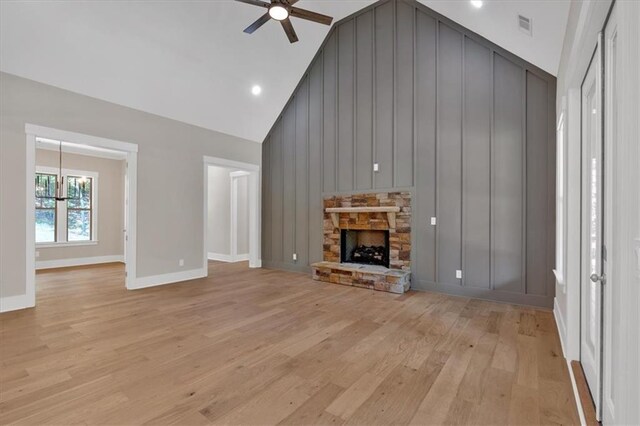 33 Cedar Gate Ln, Kingston, GA 30145 - unfurnished living room with a ceiling fan, light wood-style floors, baseboards, high vaulted ceiling, and a stone fireplace