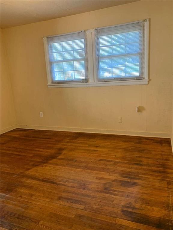 empty room featuring dark hardwood / wood-style floors