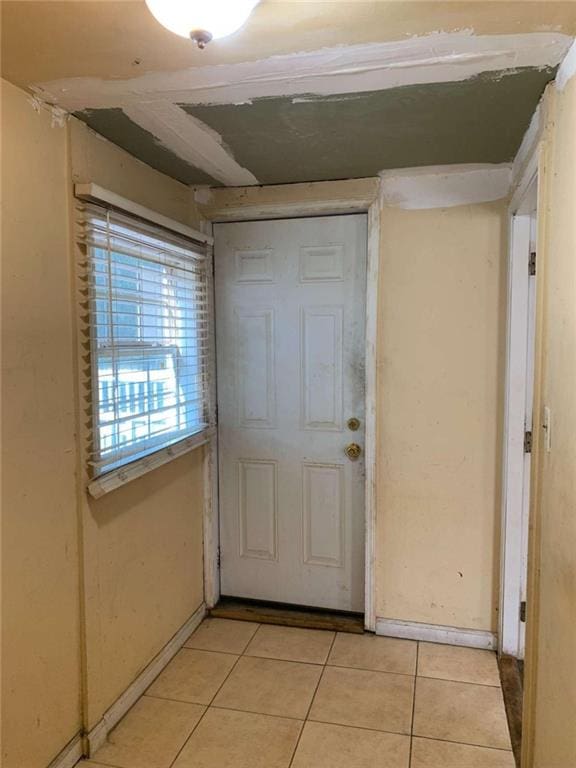 doorway featuring light tile patterned floors