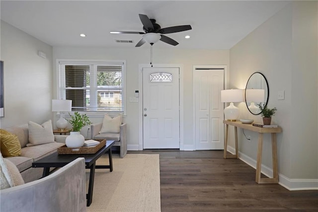 entrance foyer with ceiling fan and dark hardwood / wood-style flooring