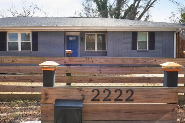 view of front of property featuring brick siding