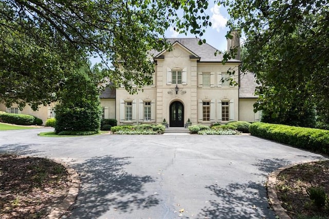 french country style house with french doors