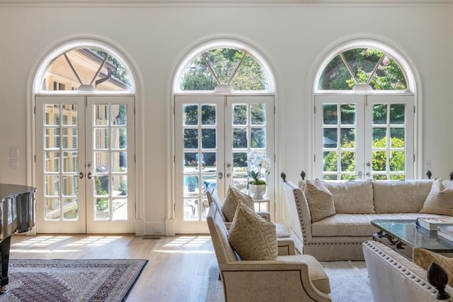 interior space with light hardwood / wood-style flooring and french doors