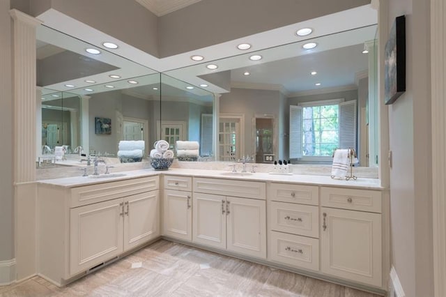 bathroom featuring vanity and crown molding