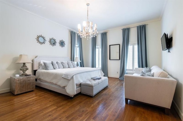 bedroom with a chandelier, crown molding, and dark hardwood / wood-style flooring