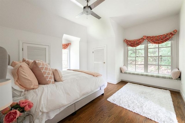 bedroom with ceiling fan and dark hardwood / wood-style floors