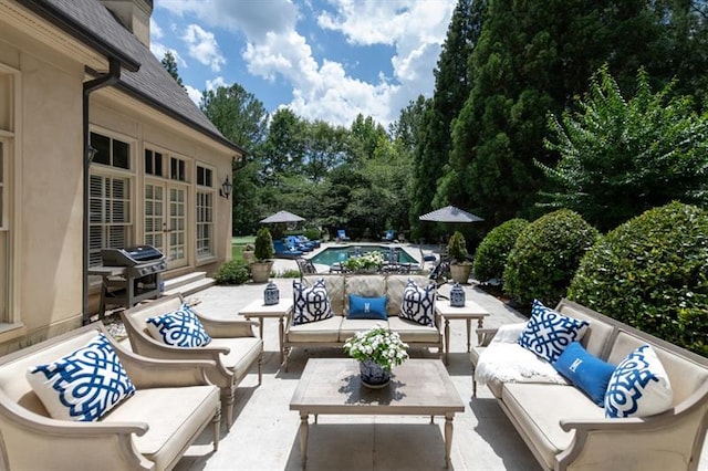 view of patio / terrace with grilling area, french doors, and an outdoor hangout area