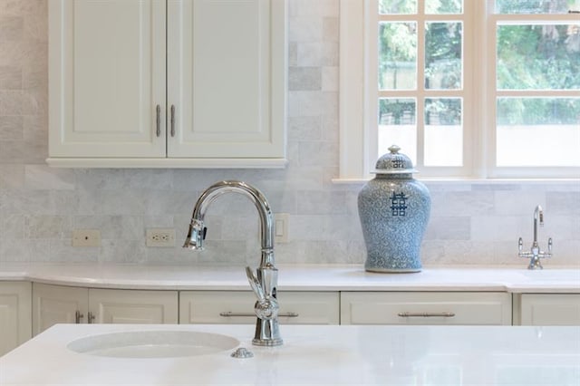 room details featuring sink and backsplash