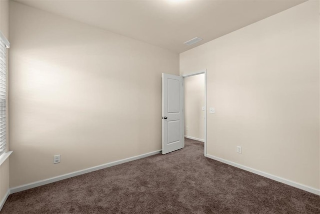 spare room featuring carpet floors