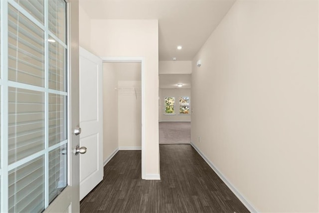 corridor featuring dark hardwood / wood-style flooring