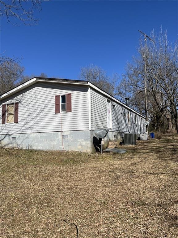 view of side of home with cooling unit