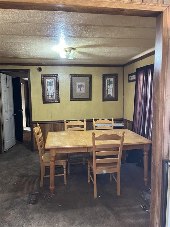 carpeted dining room featuring breakfast area