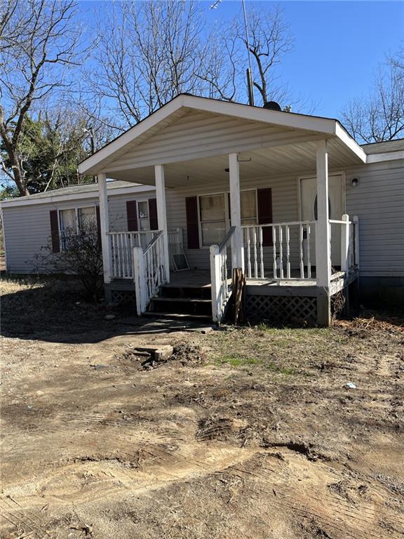 view of front of property featuring covered porch