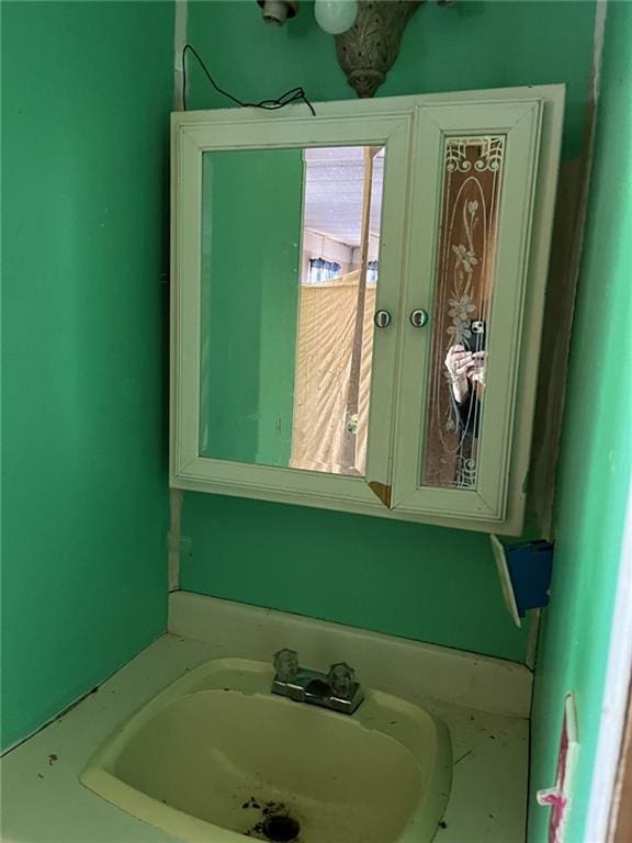 bathroom with french doors and sink