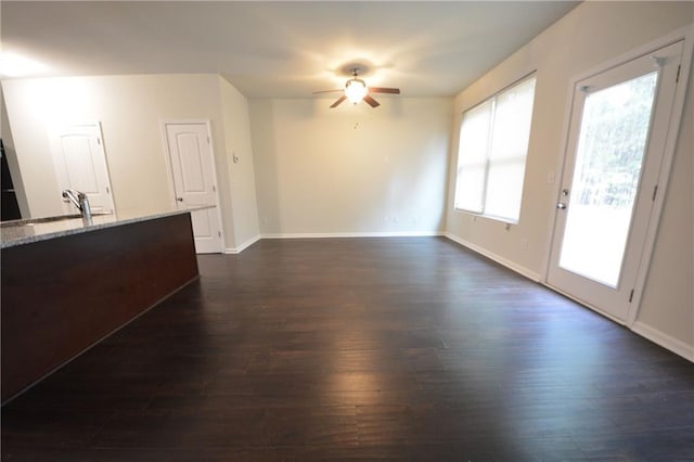 interior space with sink, ceiling fan, and dark hardwood / wood-style floors