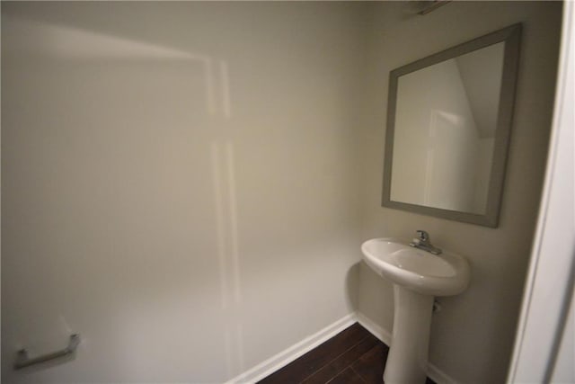 bathroom with hardwood / wood-style flooring