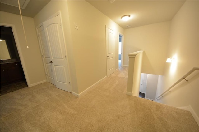 corridor with light colored carpet