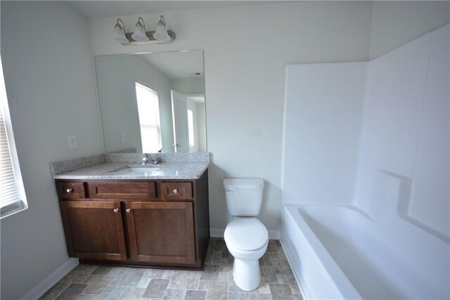 bathroom with toilet and vanity