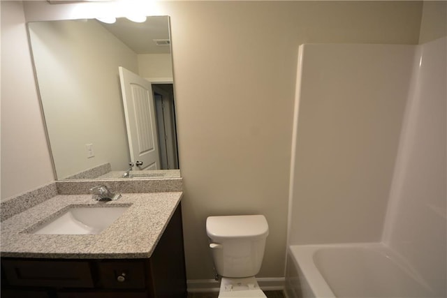 full bathroom with shower / bathing tub combination, toilet, and vanity