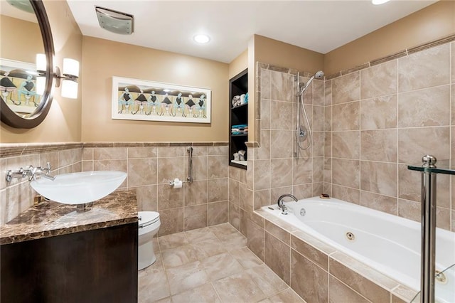 full bathroom with shower with separate bathtub, vanity, toilet, and tile patterned floors