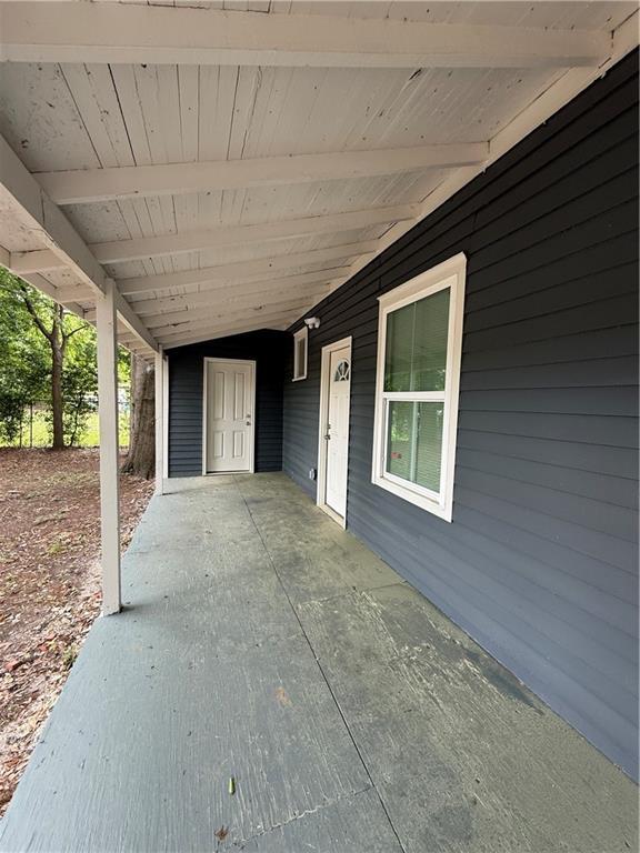 view of patio / terrace featuring an attached carport