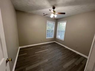 spare room featuring dark hardwood / wood-style floors