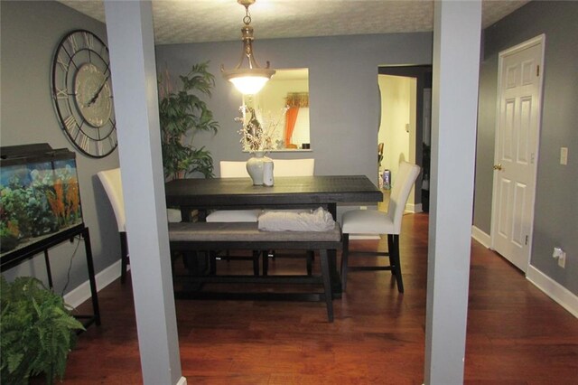 dining area featuring dark hardwood / wood-style floors