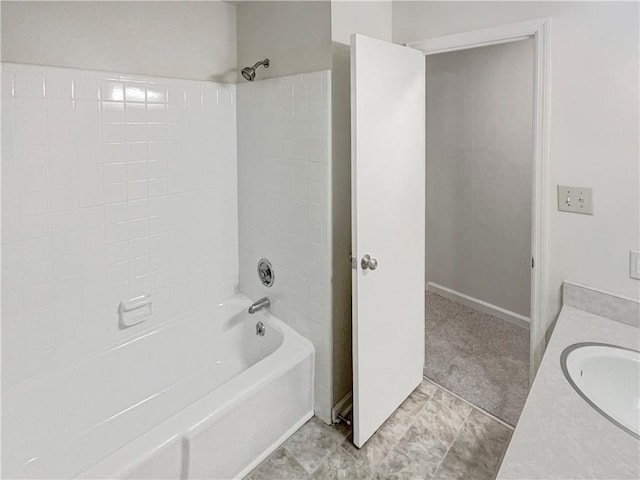 bathroom with bathtub / shower combination, tile patterned flooring, and vanity