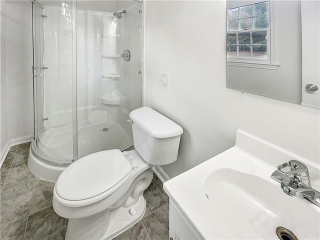 bathroom featuring tile patterned flooring, a shower with door, vanity, and toilet