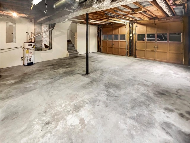 basement featuring gas water heater and electric panel