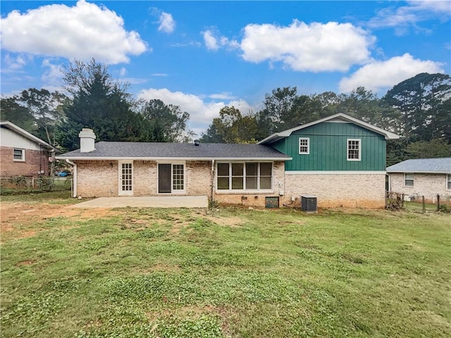 back of property featuring a patio, a yard, and central AC unit