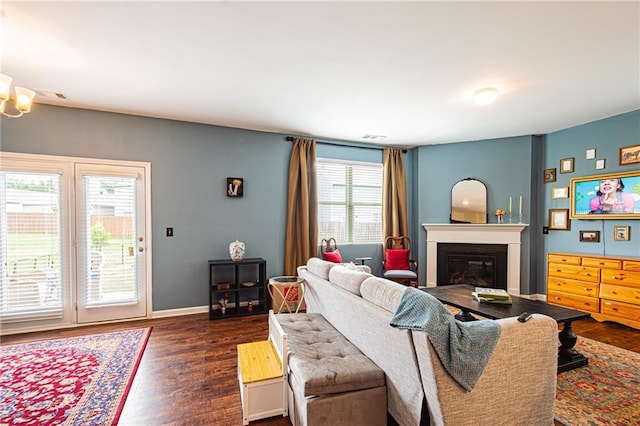 305 Thimbleberry Dr, Dawsonville, GA 30534 - living room featuring a glass covered fireplace and dark wood-style floors