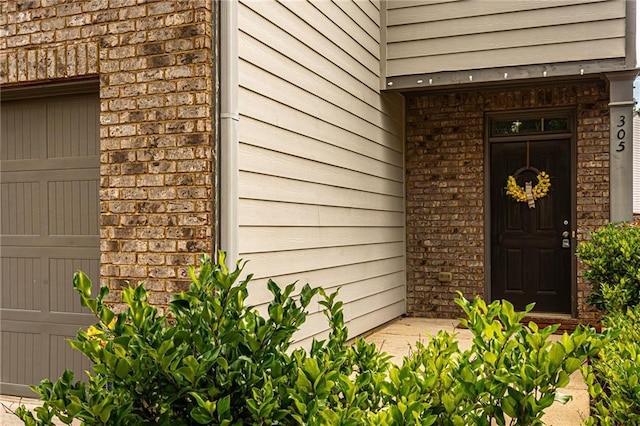 305 Thimbleberry Dr, Dawsonville, GA 30534 - doorway to property featuring brick siding