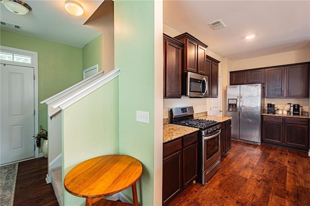 305 Thimbleberry Dr, Dawsonville, GA 30534 - kitchen featuring appliances with stainless steel finishes, dark brown cabinets, and dark wood finished floors
